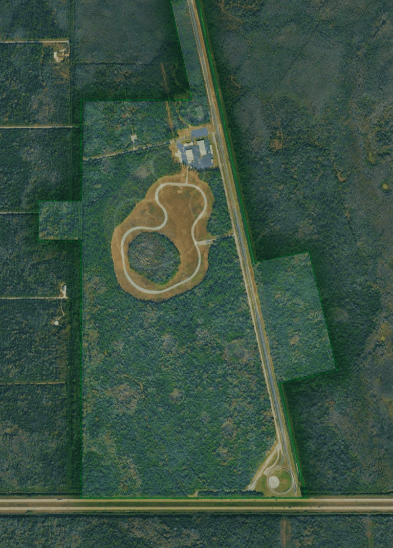 Aerial photograph of the existing former Ford proving ground, showing the 2.1-mile straightaway and the ride-and-handling loop before development.
